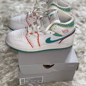 Girl’s multicolored Jordan size 6.5. Lightly worn.